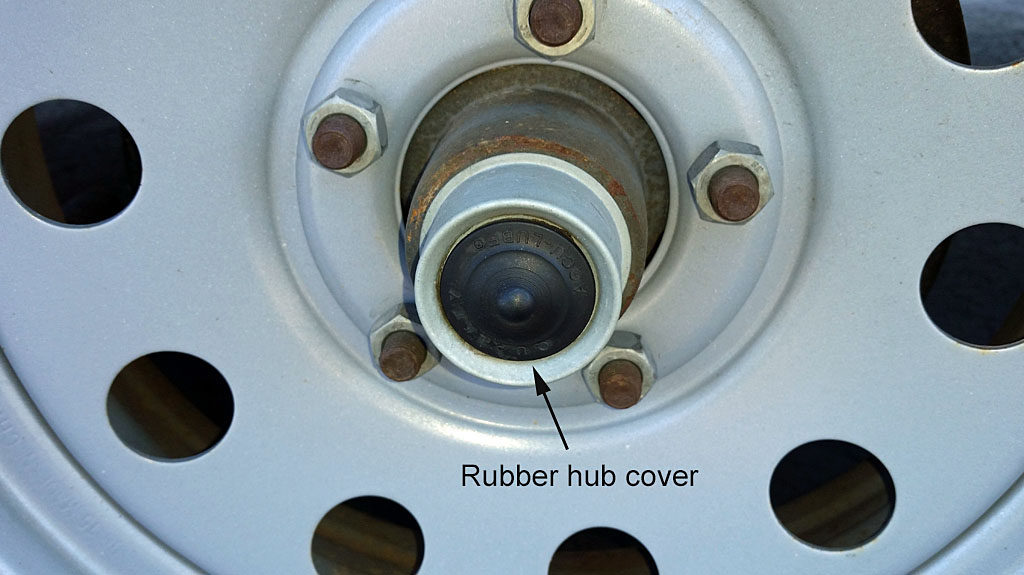 Rubber cover sealing the outer hub and bearing, covering the Zerk fitting ...